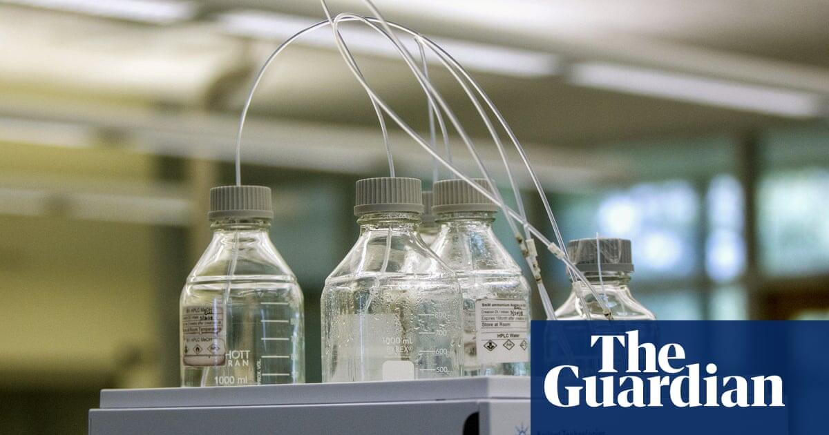 invōk.io petition & crowdfunding social platform - Two bottles of water are sitting on a table in a lab showcasing the invōk.io crowdfunding social platform.