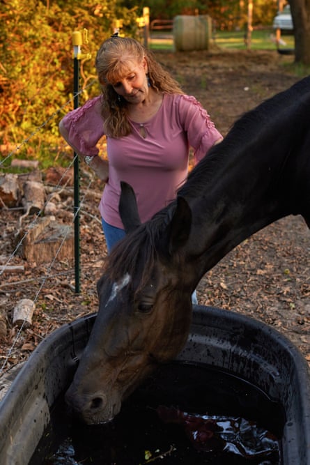 A North Carolina PFAS factory claims its emissions fell by 99.99%. A Guardian test reveals otherwise 2 A horse drinking water from a trough while a woman wearing a pink t-shirt looks over