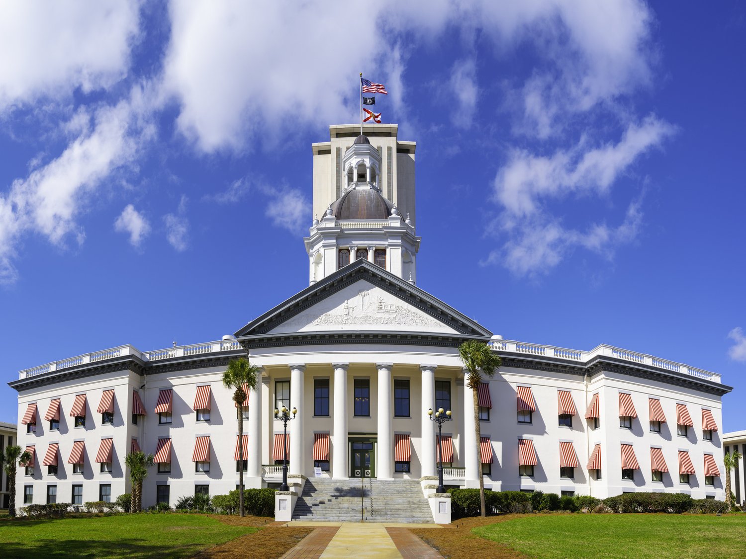 invōk.io petition & crowdfunding social platform - A large white building with a clock tower