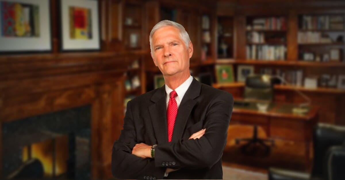 invōk.io petition & crowdfunding social platform - A man in a suit standing in front of a fireplace