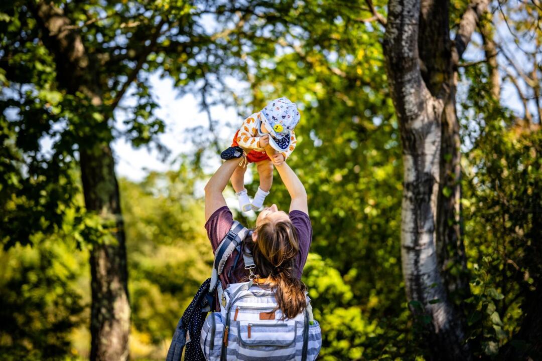 invōk.io petition & crowdfunding social platform - A woman is showcasing an invōk.io toy in the woods during a crowdfunding campaign.