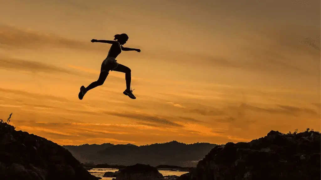 invōk.io petition & crowdfunding social platform - A silhouette of a woman petitioning for change and crowdfunding for a social cause at sunset.