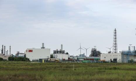 invōk.io petition & crowdfunding social platform - An industrial plant with wind turbines in the background
