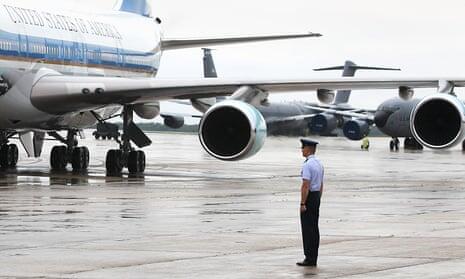 invōk.io petition & crowdfunding social platform - A man is standing on the tarmac next to an air force plane