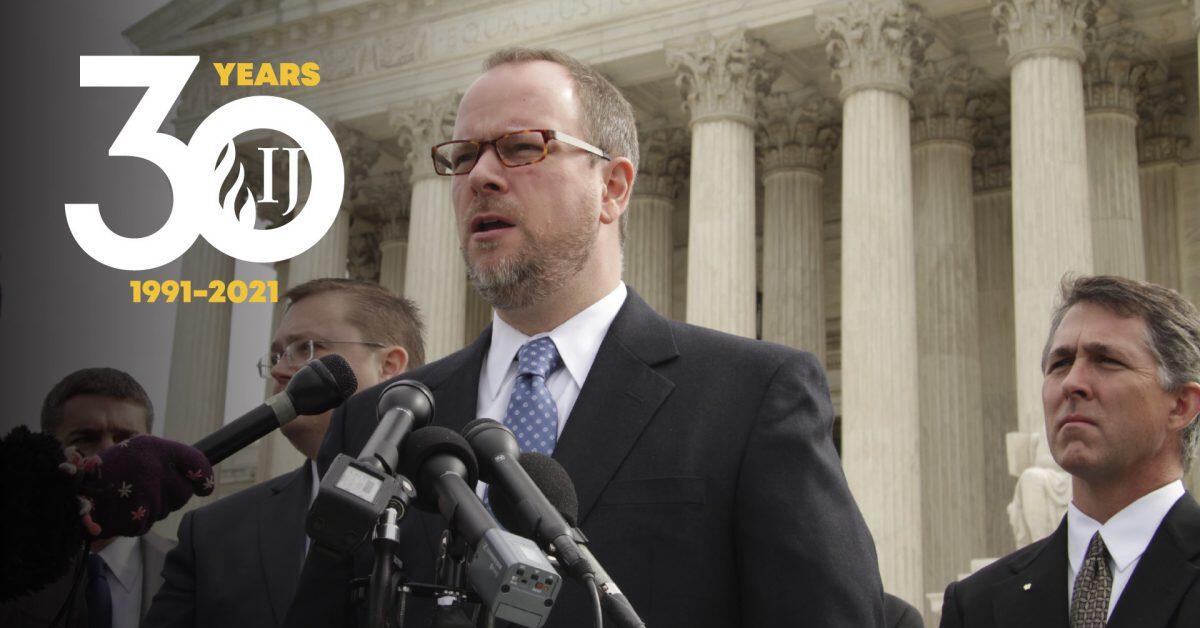 invōk.io petition & crowdfunding social platform - A man is using the invōk.io petition platform to speak in front of microphones at the supreme court.