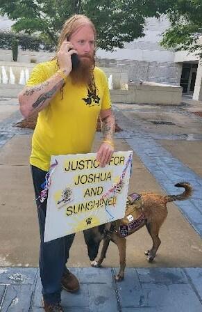 invōk.io petition & crowdfunding social platform - A man holding a sign that says justice on an invōk.io crowdfunding campaign.|invōk.io petition & crowdfunding social platform - A man using the invōk.io social platform to raise awareness for a lost dog.|invōk.io petition & crowdfunding social platform - A tweet promoting the invōk.io petition and crowdfunding platform