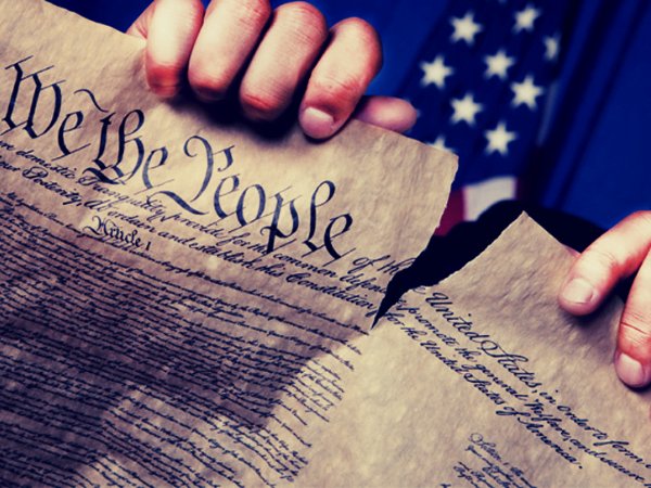 invōk.io petition & crowdfunding social platform - A hand holding a document with the words "we the people" written on it