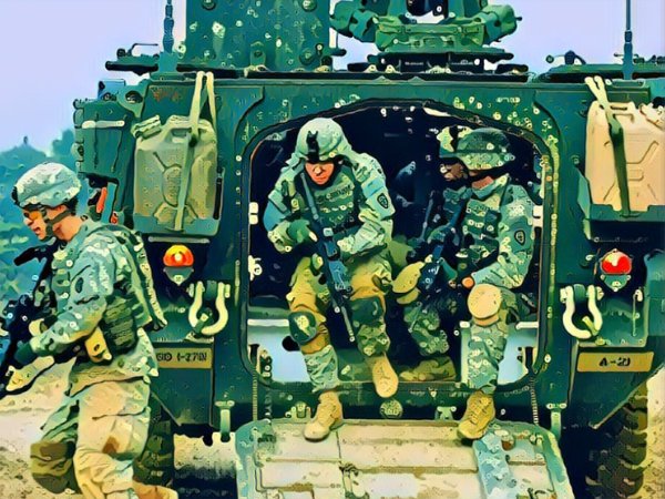 invōk.io petition & crowdfunding social platform - A squad of armed soldiers travels in an armored vehicle.