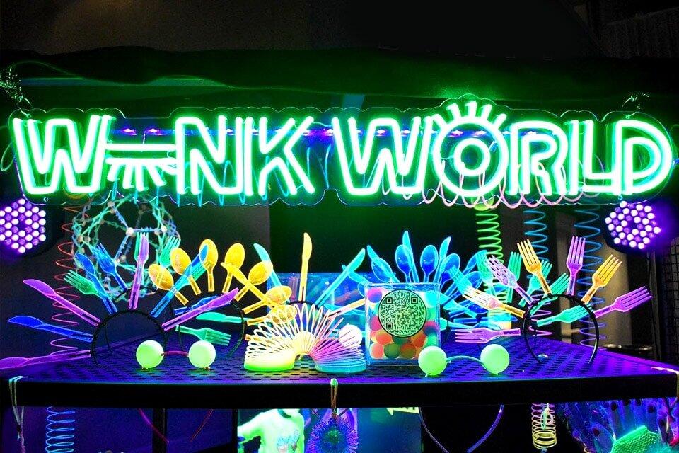 invōk.io petition & crowdfunding social platform - A neon sign that says wink world