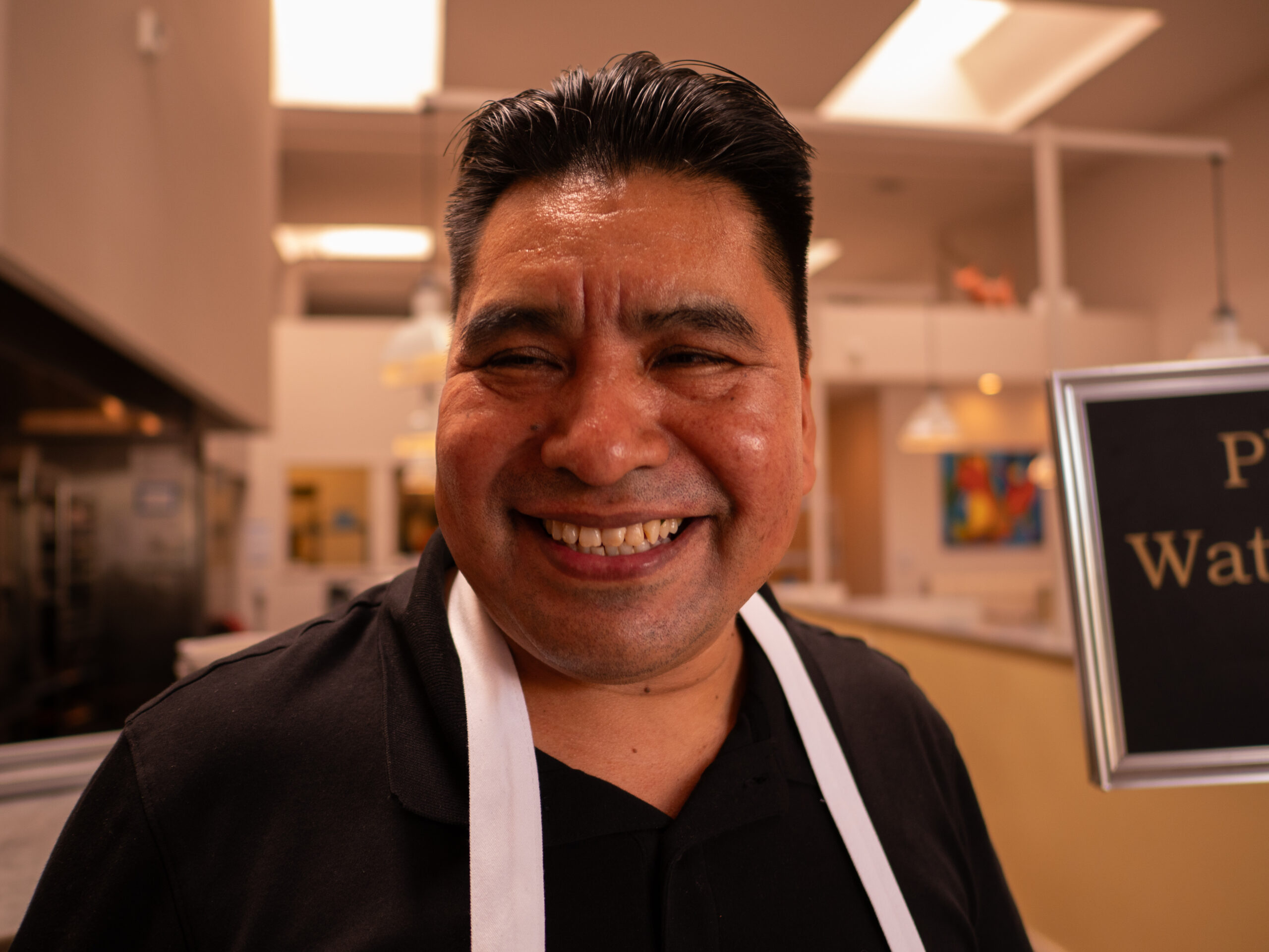 These Nine L.A. Dishwashers Are the Real Heroes of Your Favorite Restaurants 4 a man wearing an apron smiles