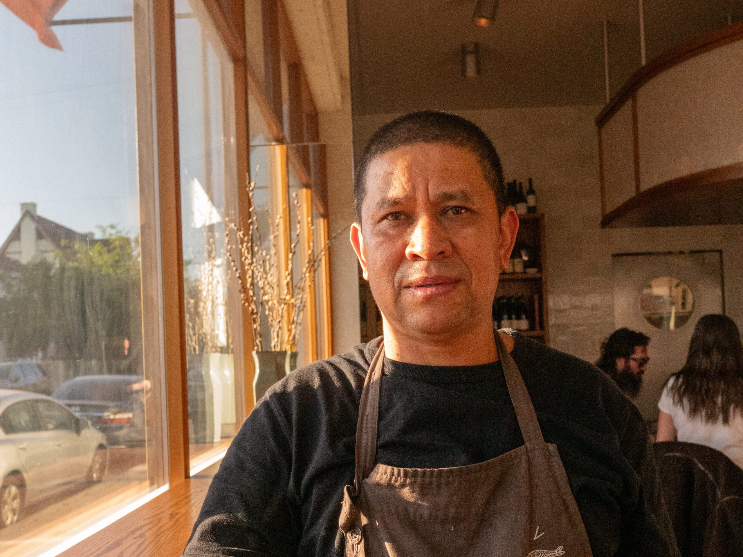 These Nine L.A. Dishwashers Are the Real Heroes of Your Favorite Restaurants 11 a man in an apron poses next to a window