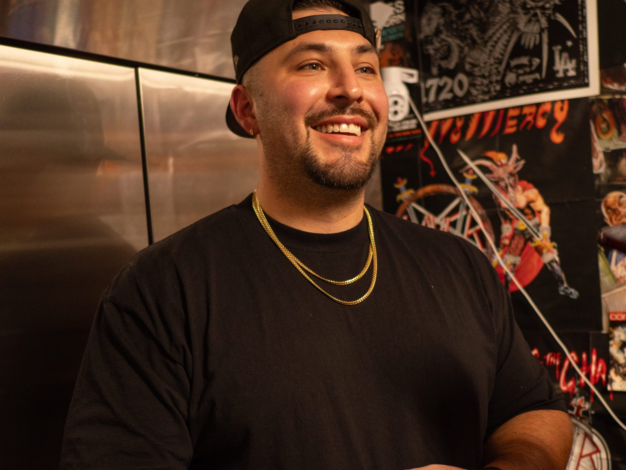 These Nine L.A. Dishwashers Are the Real Heroes of Your Favorite Restaurants 3 a man in a cap, shirt, and necklaces smiles